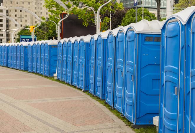 hygienic portable restrooms lined up at a beach party, ensuring guests have access to the necessary facilities while enjoying the sun and sand in Fort Myers